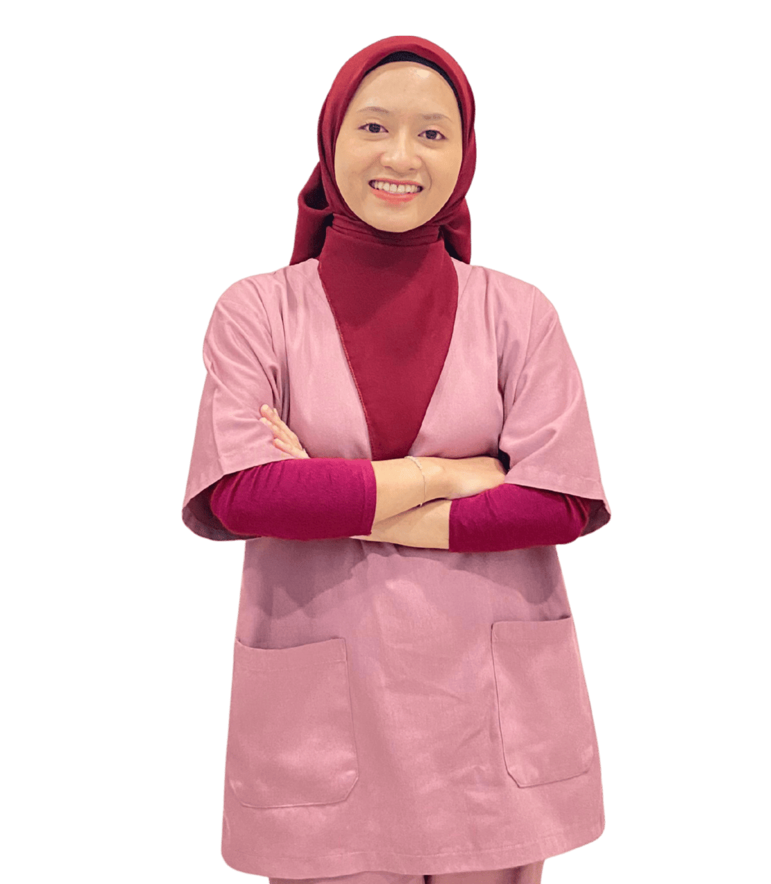 Portrait of Fadiya Nada, a professional nutritionist with a warm smile, wearing a white coat and standing in a bright, modern nutrition consultation room with plants and healthy food items on the table